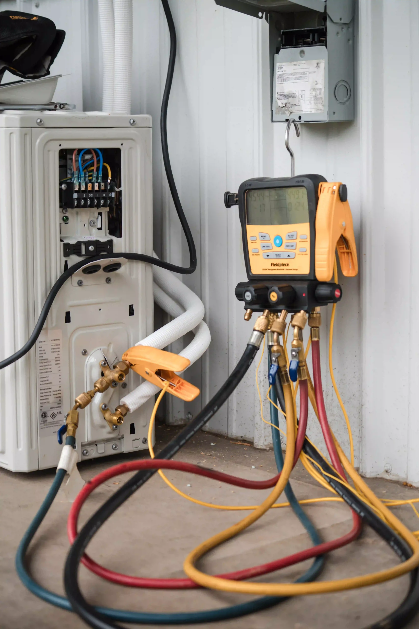 Mini split unit hooked up with Freon gauge